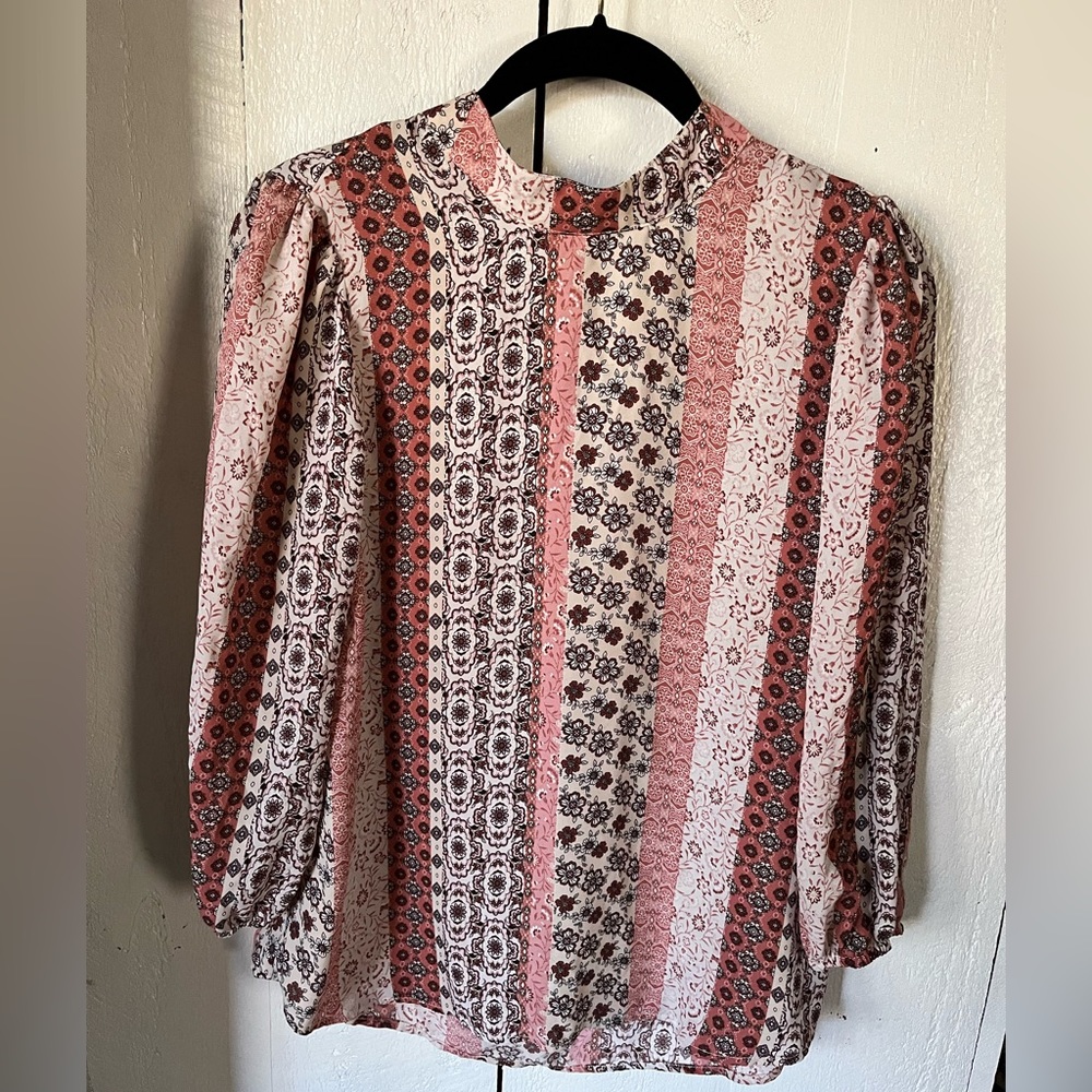 Peasant style, high neck blouse.